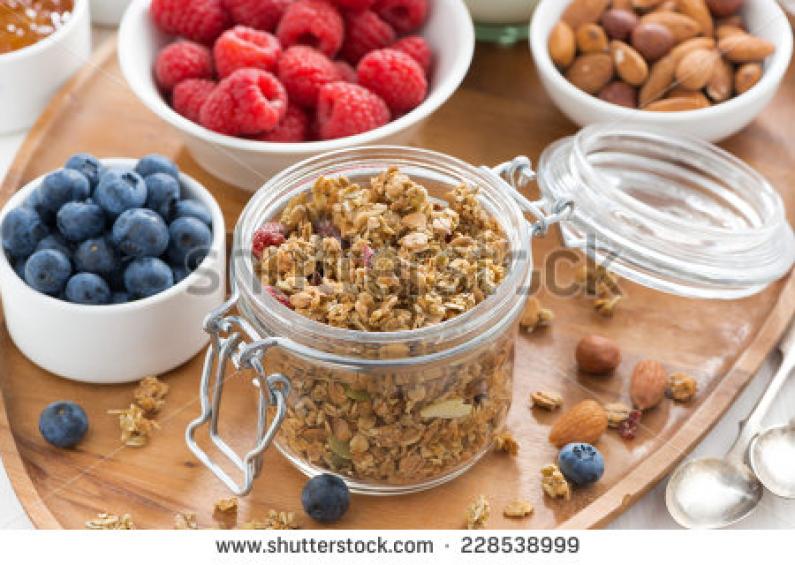 stock photo glass jar with homemade granola and berries top view 228538999